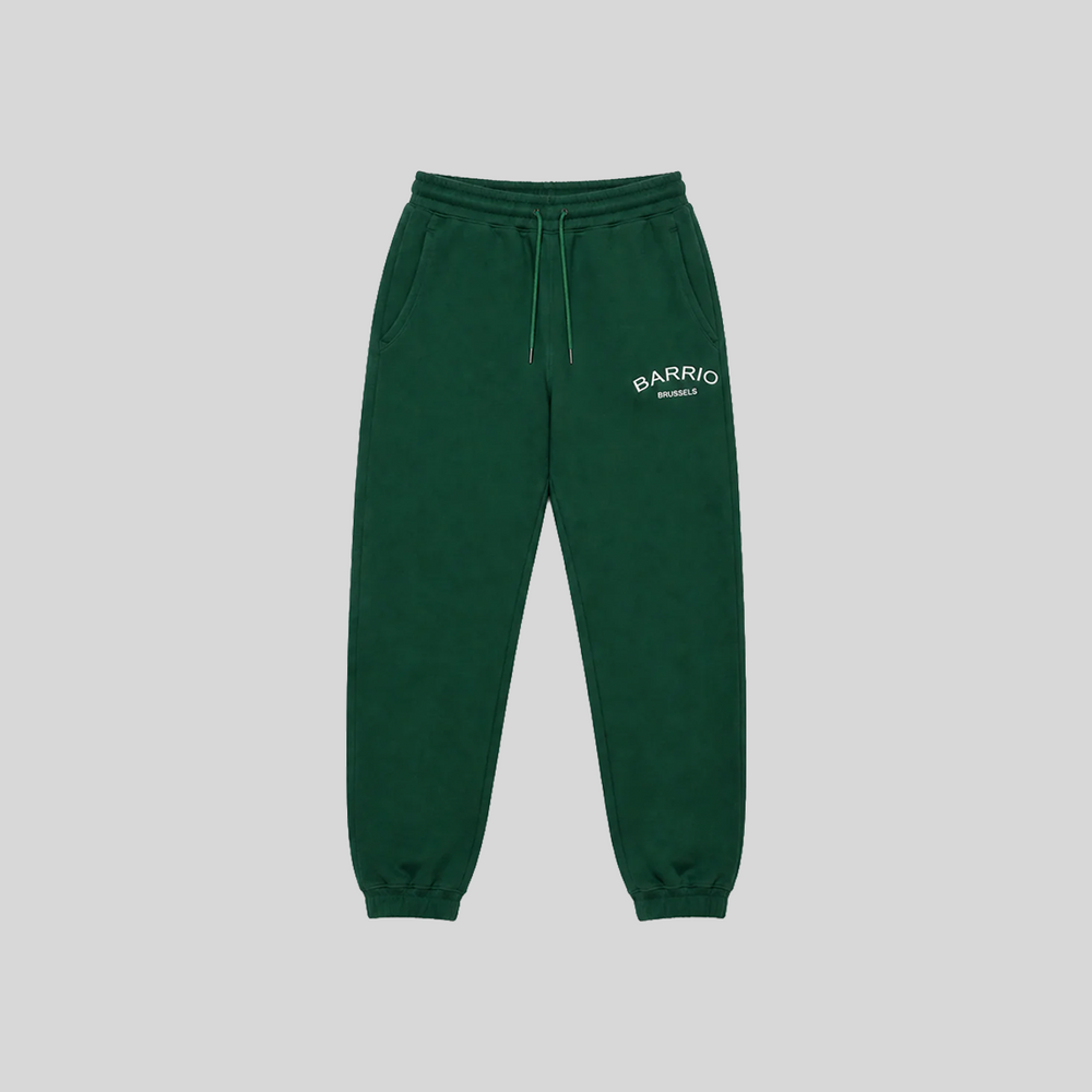 Barrio Clothing Brussels Forest green jogger pants embroidered white logo, tapered fit with elasticated cuffs, front view